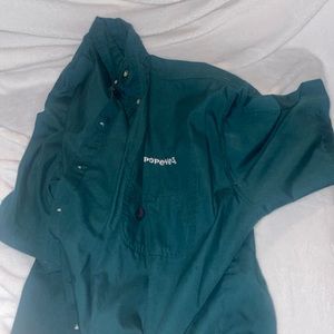 Dark green, popeyes uniform, button down.